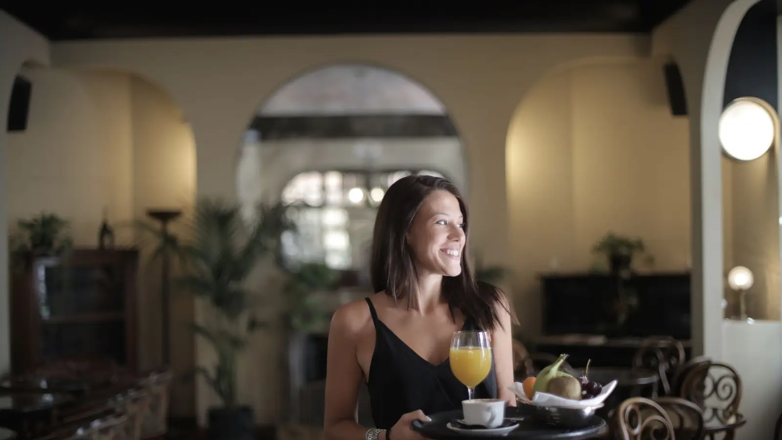 Hotel restaurant with tables set for breakfast